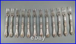 A Victorian twelve place canteen of silver plate fish knives and forks