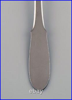 Gundorph Albertus for Georg Jensen. 12 Mitra stainless steel dessert spoons