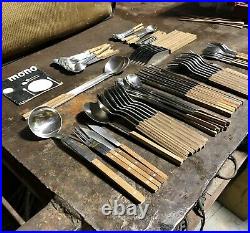 Peter Raacke Mono-t stainless and teak flatware. 1960. 76 Pieces Service For 8